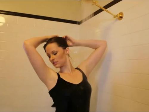 Sexy girl in leather trousers taking a shower
